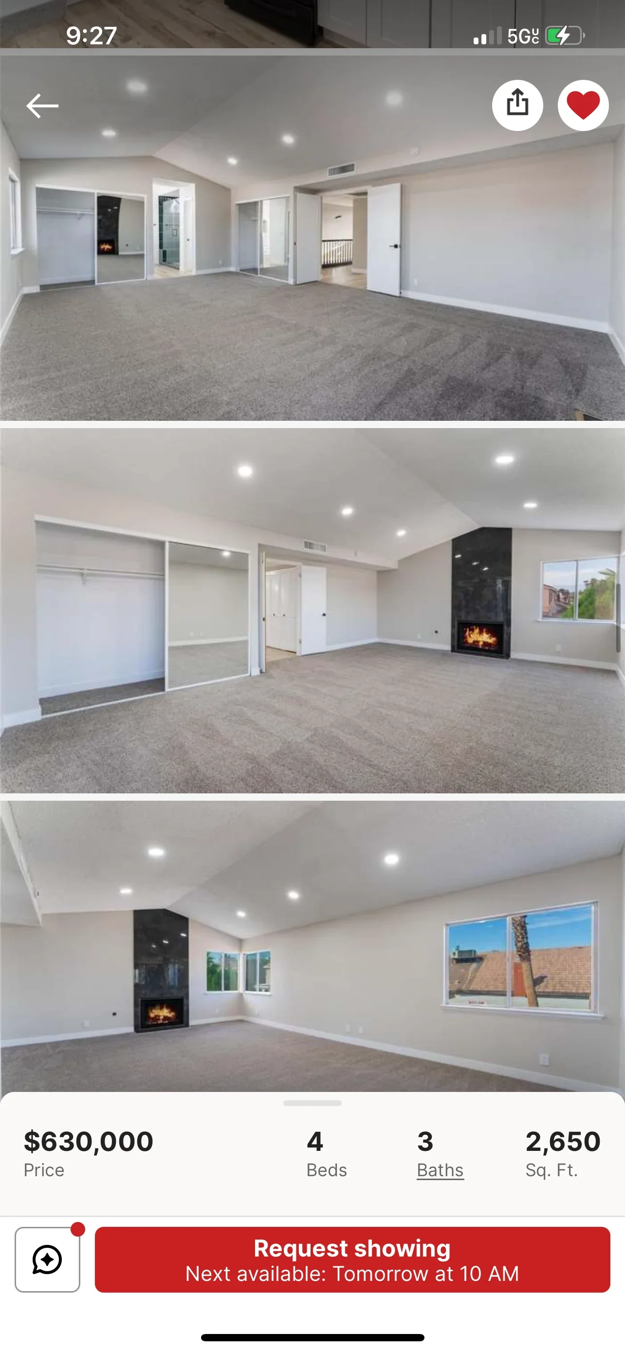 Renovated bedroom and living space with new carpet, recessed lighting, and fireplace accent wall